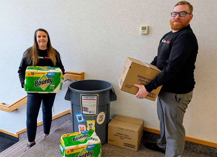 Abby and Alex with food pantry donations